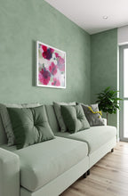 Load image into Gallery viewer, Green sofa with decorative pillows in a room with green walls and a floral painting.
